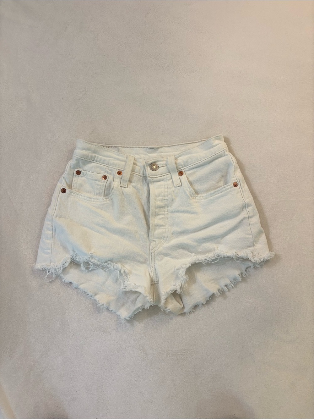 Levi’s 501 white high waisted jean shorts